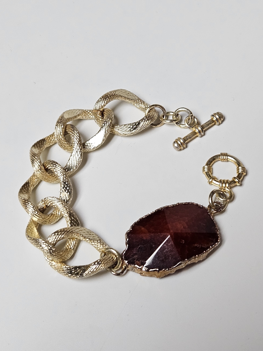 Chunky Gold Chain Bracelet with Deep Red Faceted Stone